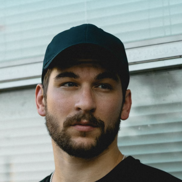 Man wearing black baseball cap
